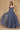 A stunning periwinkle long formal ball gown adorned with sparkling embellishments, elegantly flowing to the floor, perfect for a glamorous evening event.