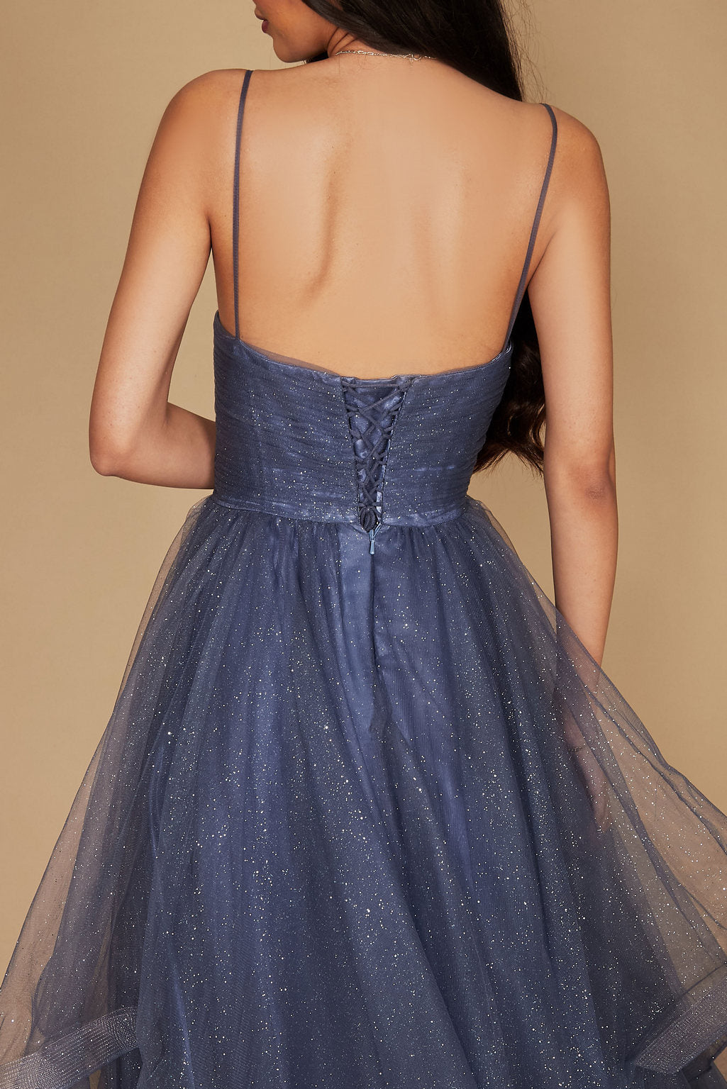 A stunning periwinkle long formal ball gown adorned with sparkling embellishments, elegantly flowing to the floor, perfect for a glamorous evening event.