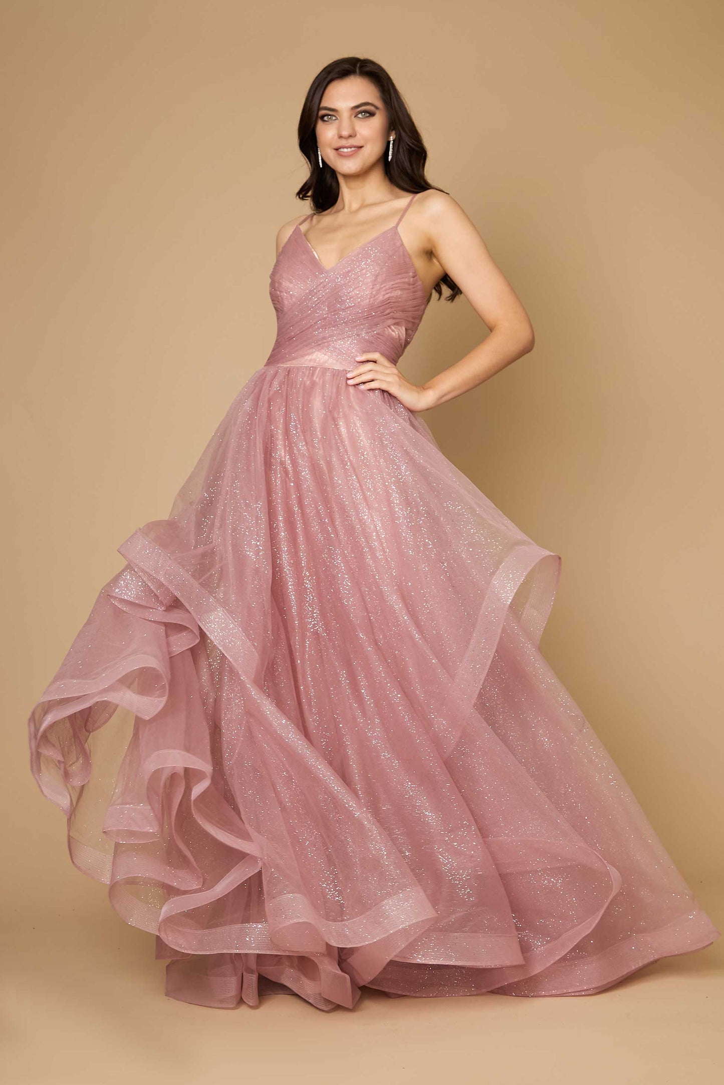 A stunning mauve long formal ball gown adorned with sparkling embellishments, elegantly flowing to the floor, perfect for a glamorous evening event.