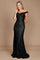 A sleek black mermaid fitted evening dress elegantly hugs the silhouette, featuring a sophisticated neckline and a dramatic flared hem that cascades to the floor.