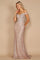 A formal mermaid fitted evening dress in a stunning rose gold hue, featuring a sleek silhouette that elegantly flares at the bottom, adorned with intricate detailing and a sophisticated neckline.