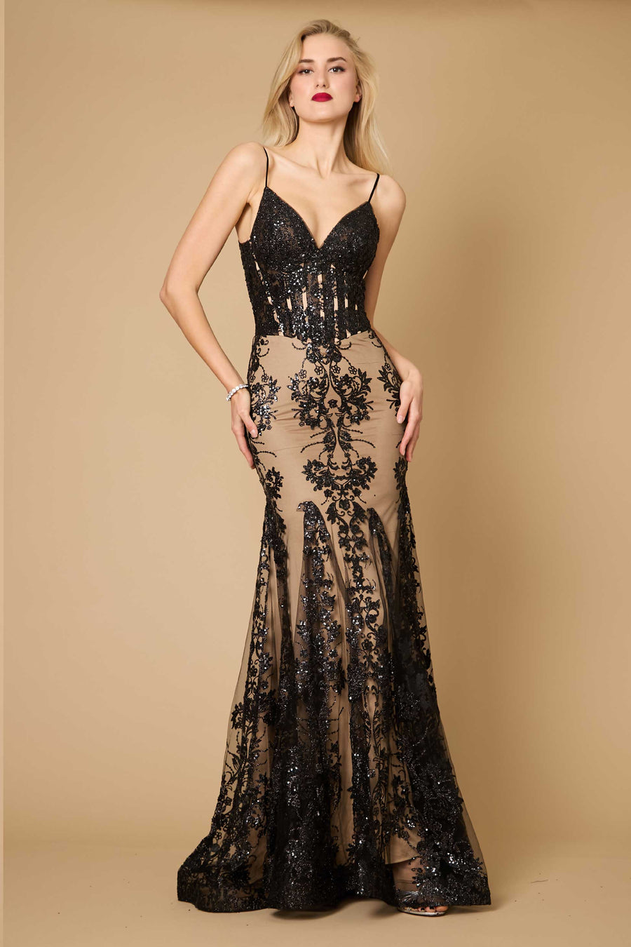 A stunning fitted corset long formal prom dress featuring a black and nude color scheme, elegantly hugging the silhouette with intricate detailing and a flowing skirt.