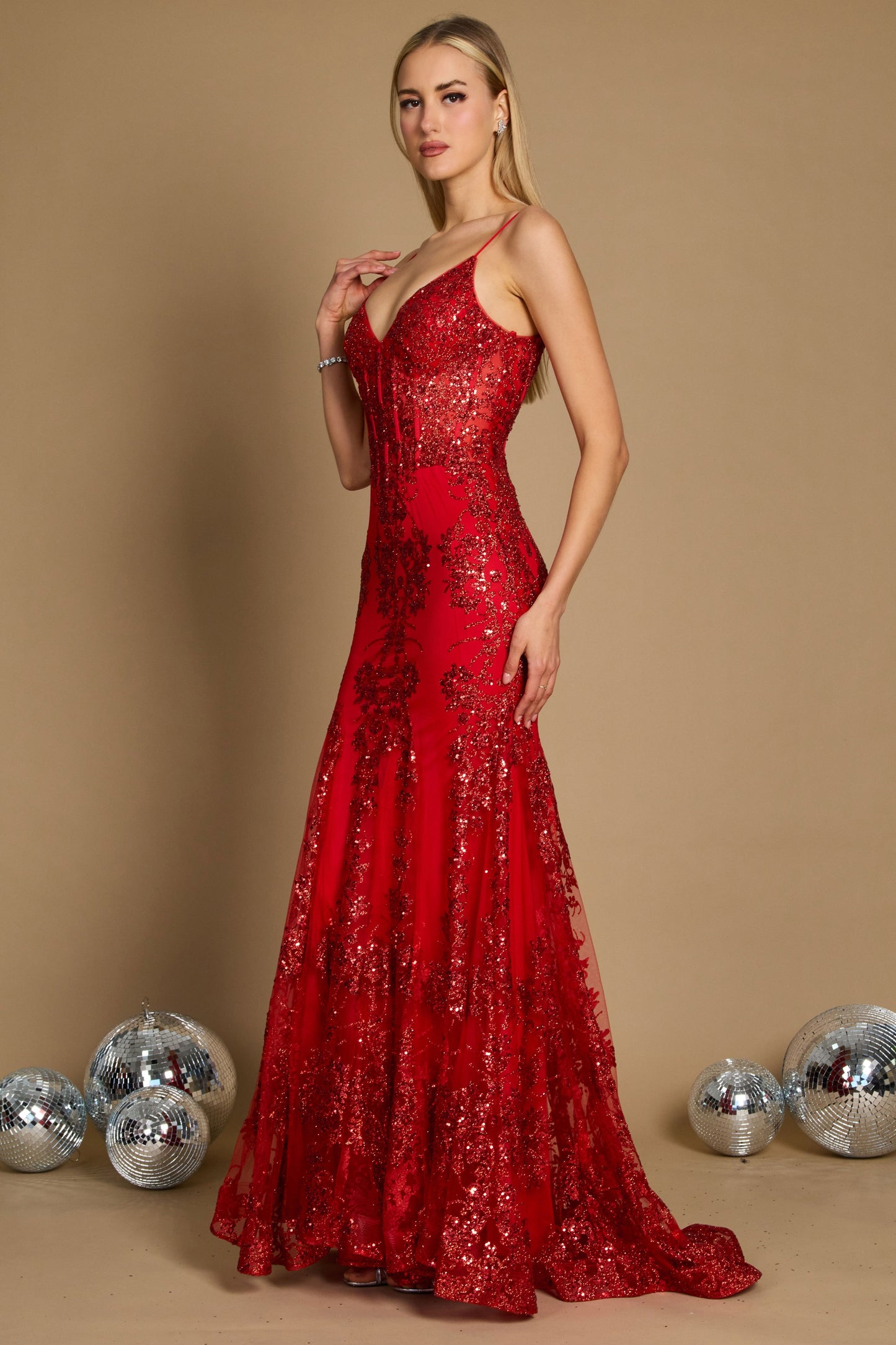 A stunning red fitted corset long formal prom dress, elegantly designed to accentuate the waist and create a flattering silhouette, featuring intricate detailing and a flowing skirt that cascades to the floor.