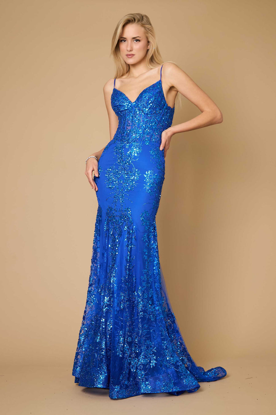 A stunning royal blue fitted corset long formal prom dress, elegantly designed with intricate detailing and a flowing skirt, perfect for a glamorous evening event.