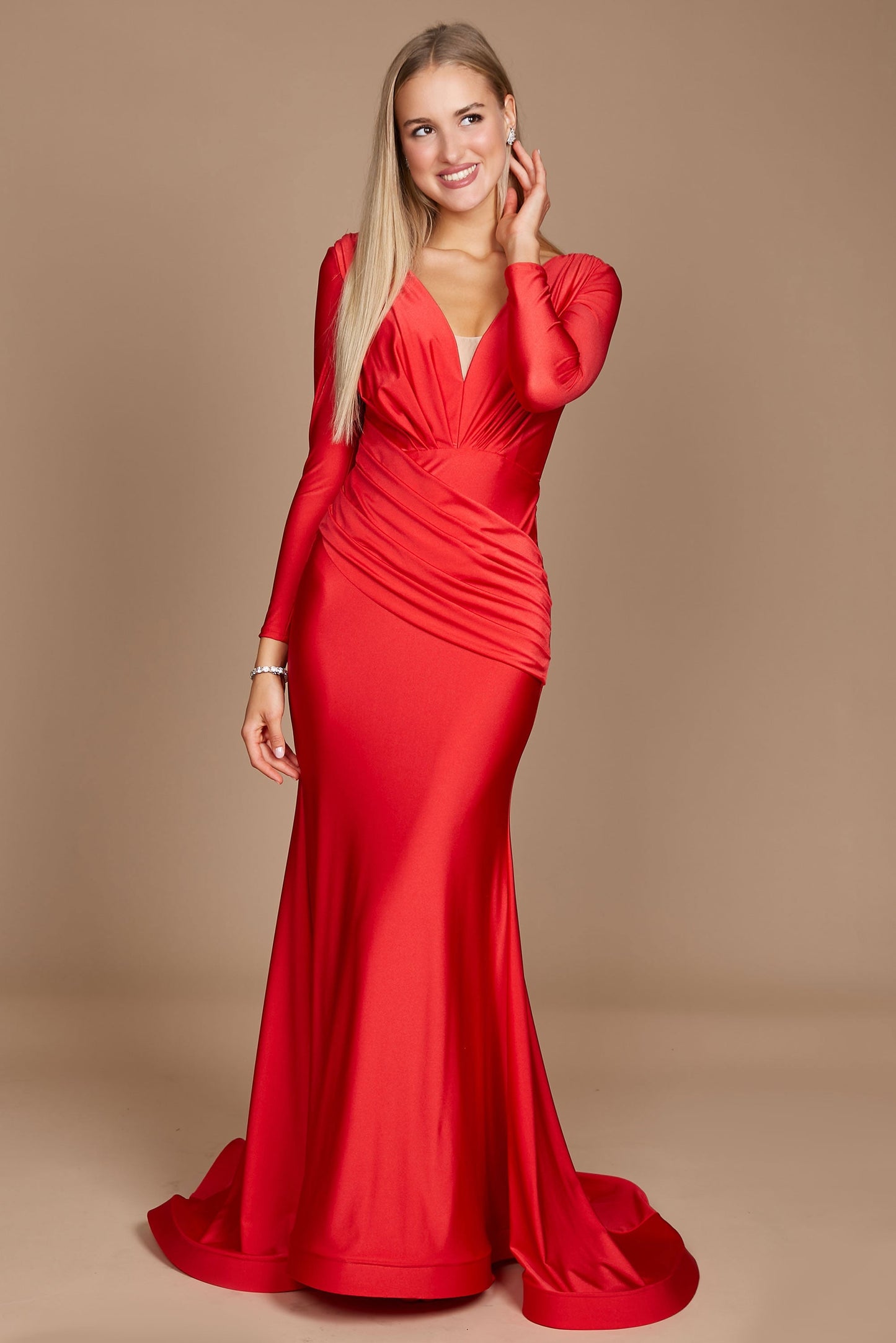 A stunning long sleeve formal fitted evening dress in vibrant red, elegantly tailored to accentuate the silhouette, featuring a sophisticated neckline and flowing fabric that cascades gracefully to the floor.