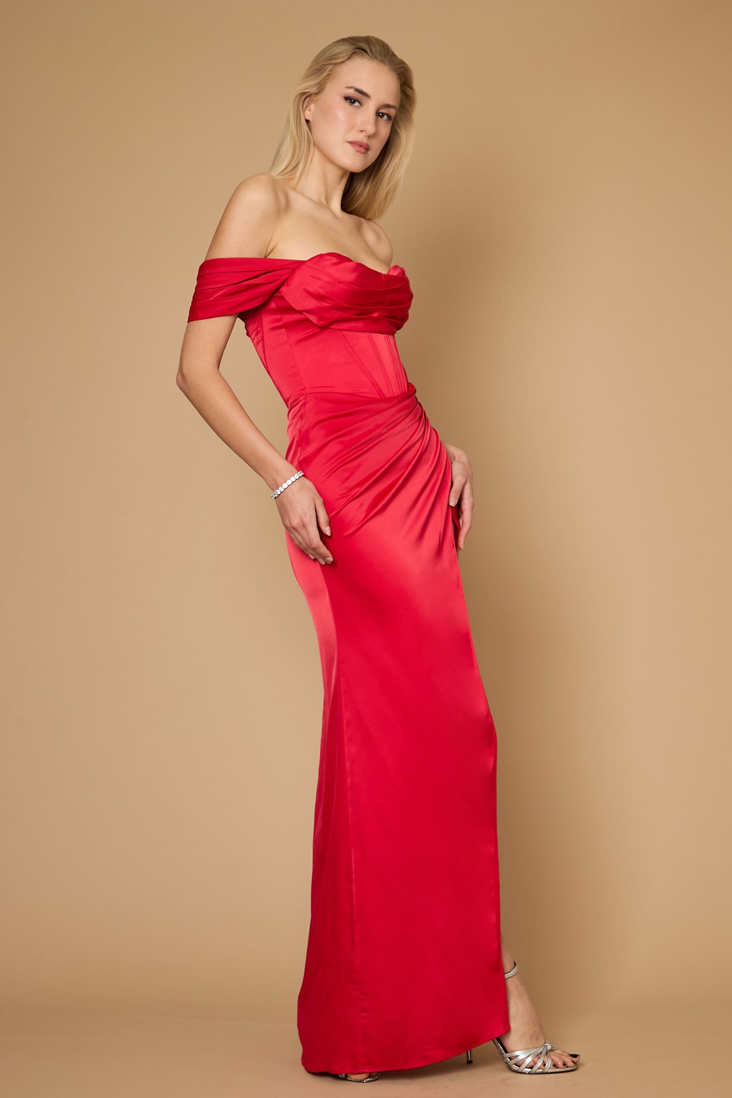 A stunning long formal corset satin evening dress in vibrant red, featuring a fitted bodice with intricate corset detailing and a flowing skirt that elegantly cascades to the floor, perfect for formal occasions.