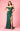 A stunning emerald green fitted off-shoulder prom dress adorned with shimmering sequins, elegantly showcasing a flattering silhouette and a glamorous look perfect for formal occasions.