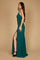 A stunning emerald green long fitted prom dress featuring an open back design, elegantly draping to the floor, perfect for a formal evening event.