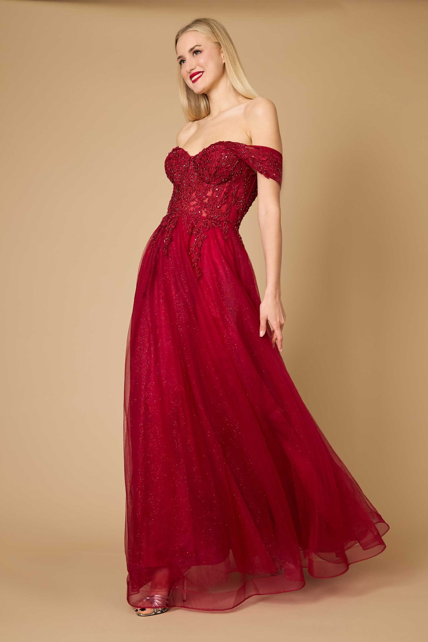 A stunning burgundy long off-shoulder corset formal dress, featuring elegant draping and a fitted bodice that accentuates the waist, perfect for a sophisticated evening event.