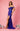 A stunning royal blue fitted off-shoulder prom dress adorned with shimmering sequins, elegantly showcasing a flattering silhouette and a glamorous look perfect for formal occasions.