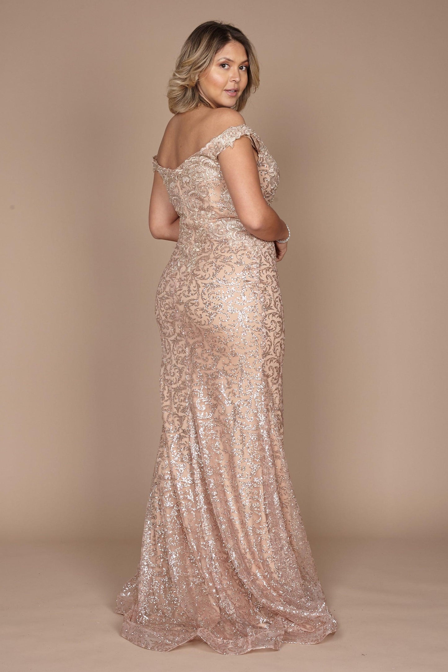 A stunning formal mermaid fitted evening dress in a luxurious gold hue, featuring a sleek silhouette that elegantly hugs the body and flares out at the bottom, perfect for a glamorous night out.