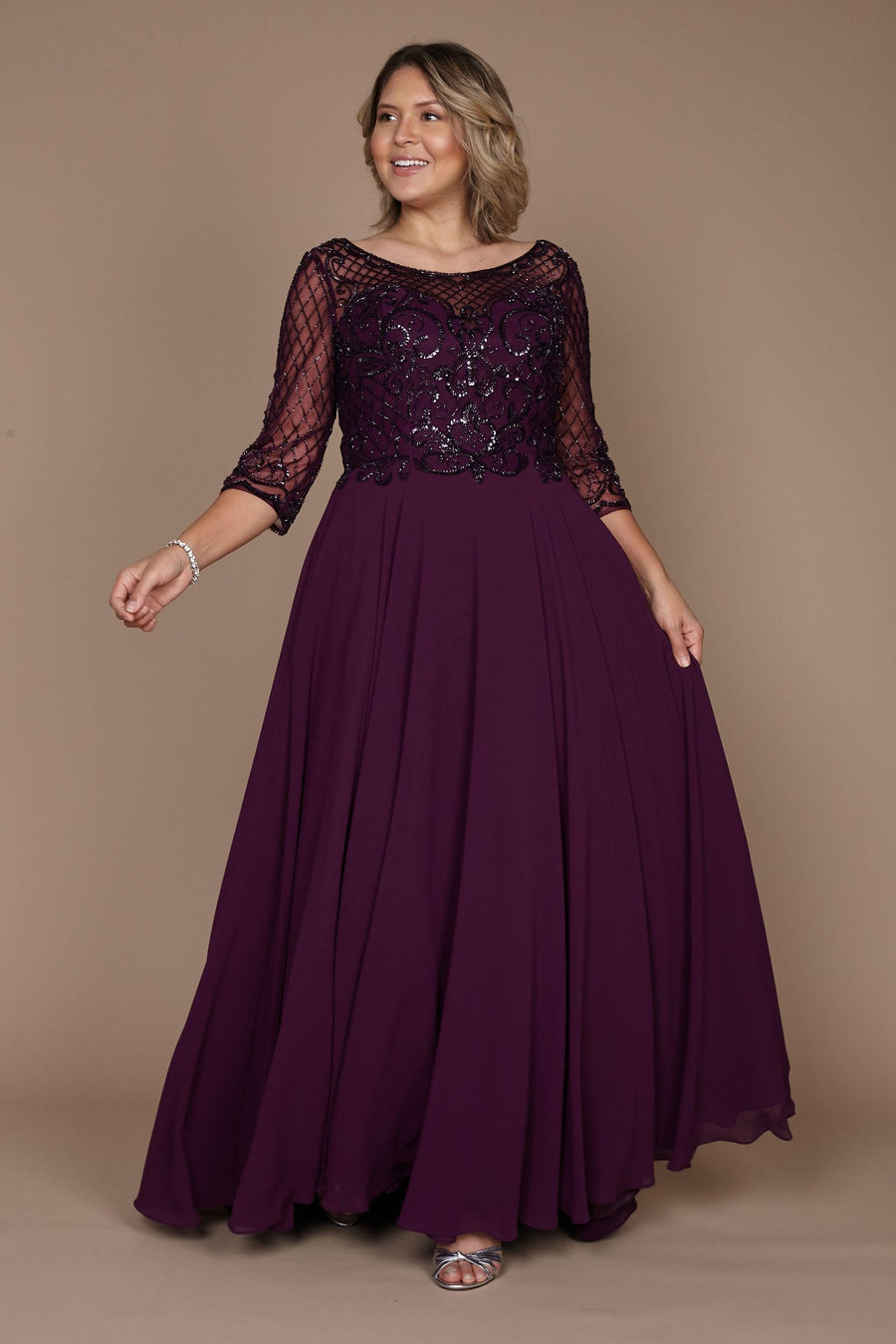 Elegant long sleeve mother of the bride dress in rich eggplant, adorned with intricate hand-beaded details, showcasing a sophisticated silhouette perfect for a formal wedding.