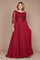 Elegant long sleeve mother of the bride dress in rich burgundy, adorned with intricate hand-beaded detailing, showcasing a sophisticated silhouette perfect for a formal wedding.