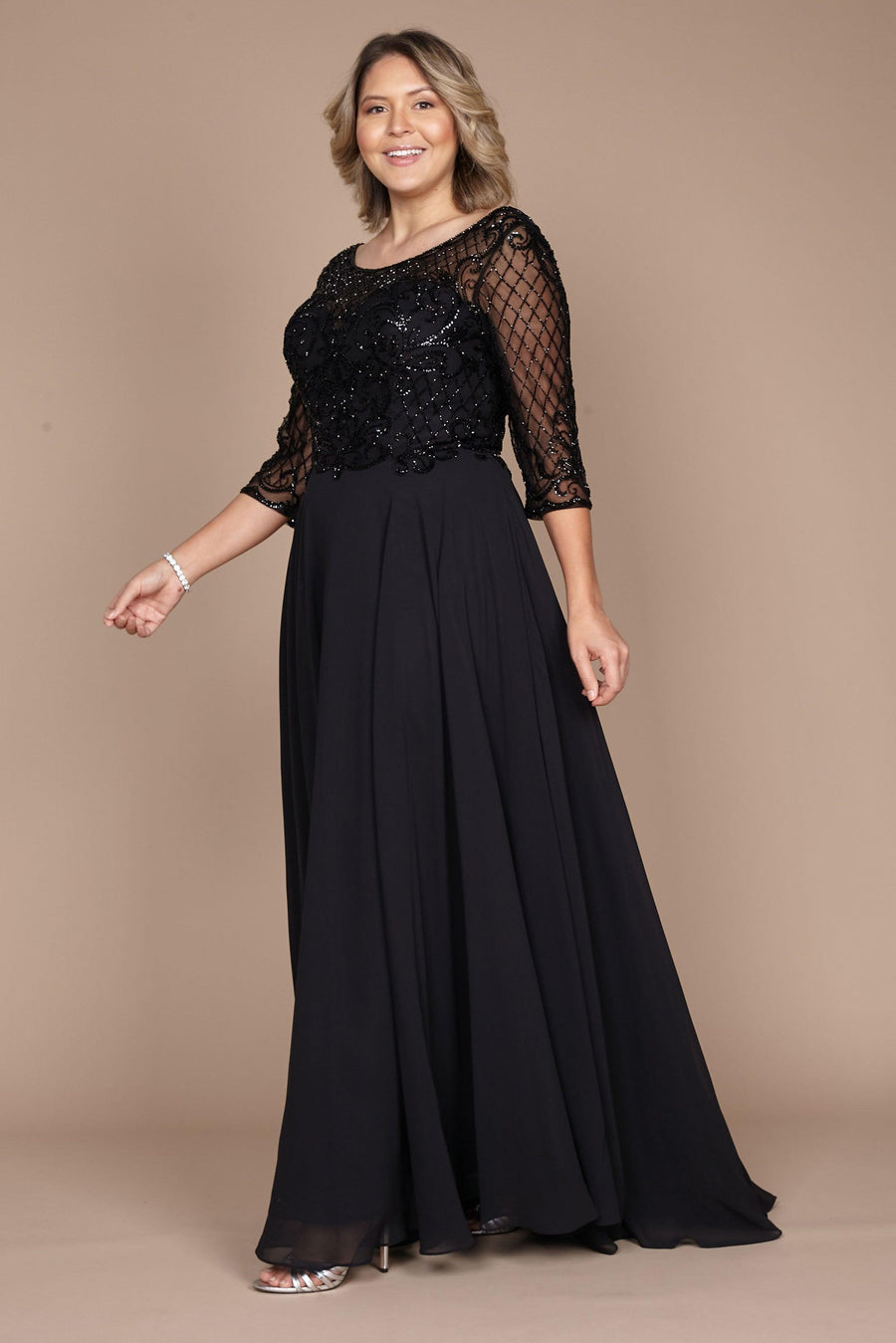 Elegant long sleeve black dress adorned with intricate hand-beaded details, designed for the mother of the bride, showcasing a sophisticated and timeless silhouette.