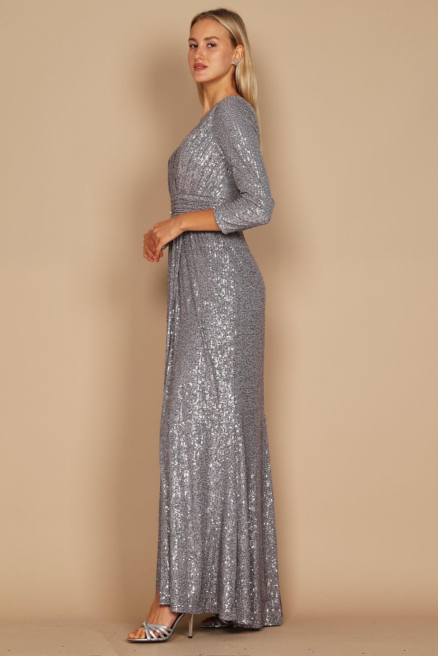 A stunning charcoal long sleeve formal dress adorned with intricate hand-beaded sequins, showcasing elegance and sophistication.